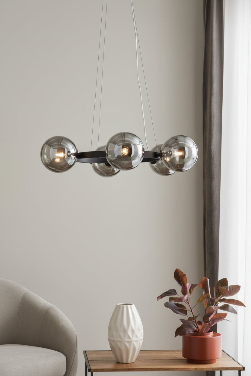 Modern chandelier with glass shades on a brown wall