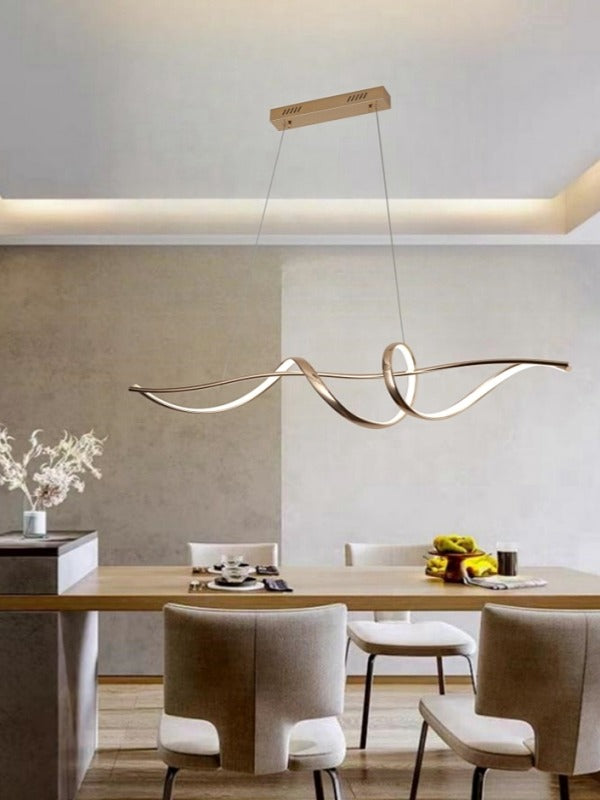 Modern dining room with a stylish pendant light fixture.